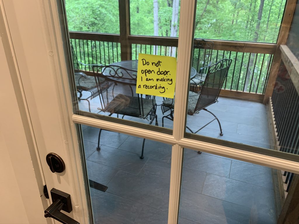 Post-it note on door: An attempt to communicate: "Do not open door. I am making a recording."