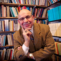 Dr. Frank Spina in front of books